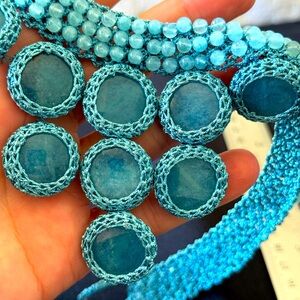 Aqua blue necklace - beautiful crystal gems bound with intricate crochet work.